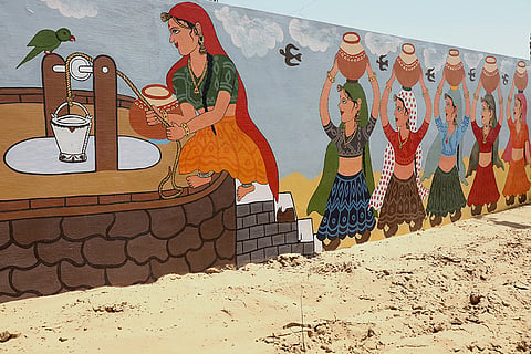 Artwork on Women Collecting Water from Well